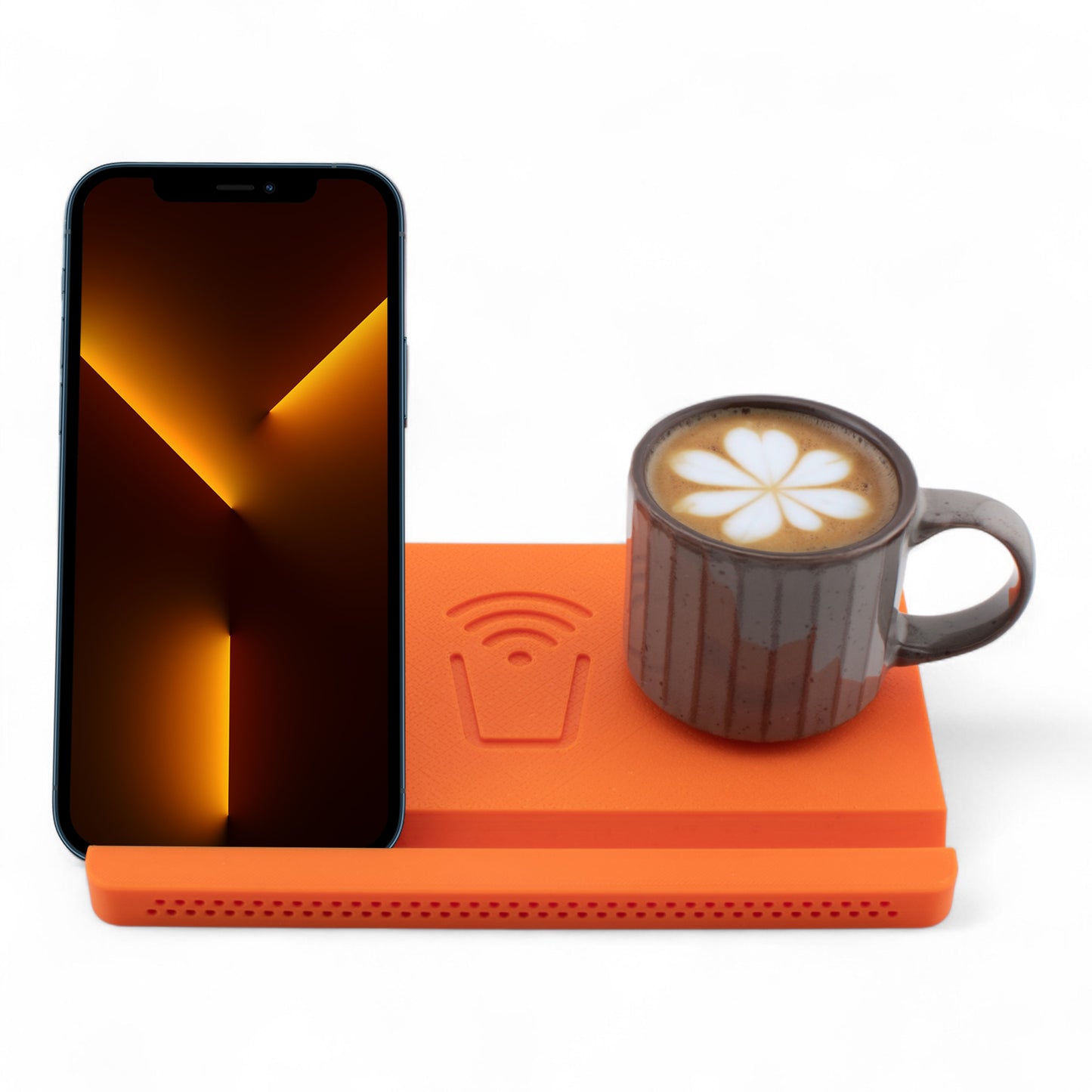 Smartphone and coffee mug on an orange coaster on a white background front facing