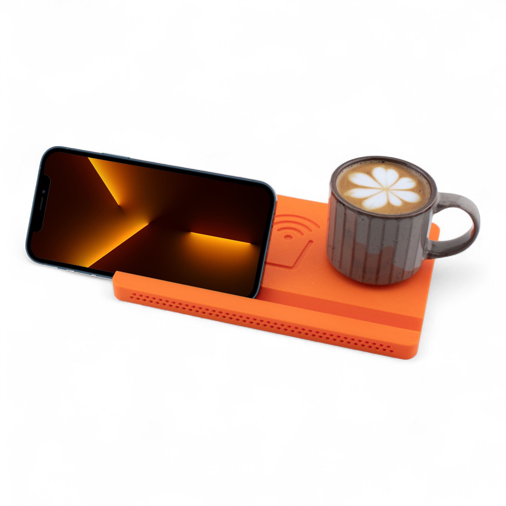 Landscape smartphone and coffee mug on an orange coaster on a white background left angle