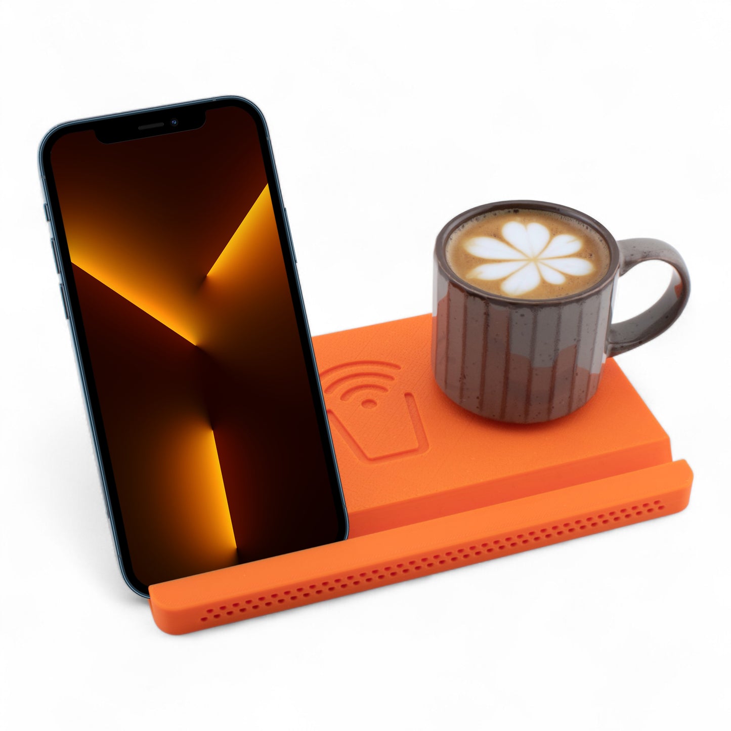 Smartphone and coffee mug on an orange coaster on a white background right angle