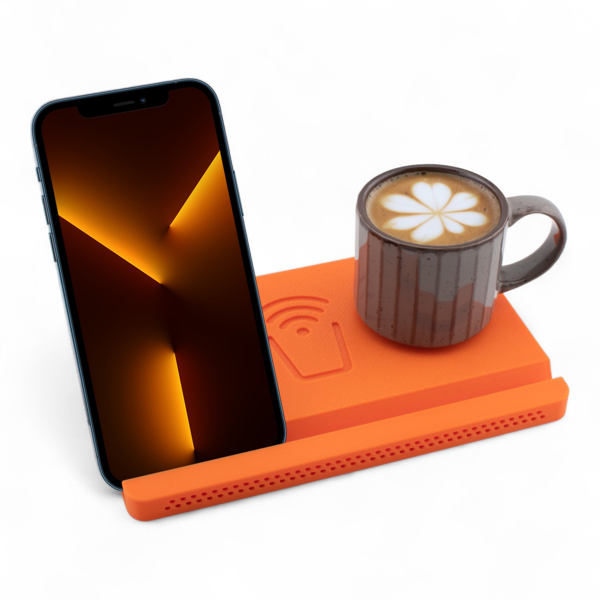 Smartphone and coffee mug on an orange coaster on a white background right angle