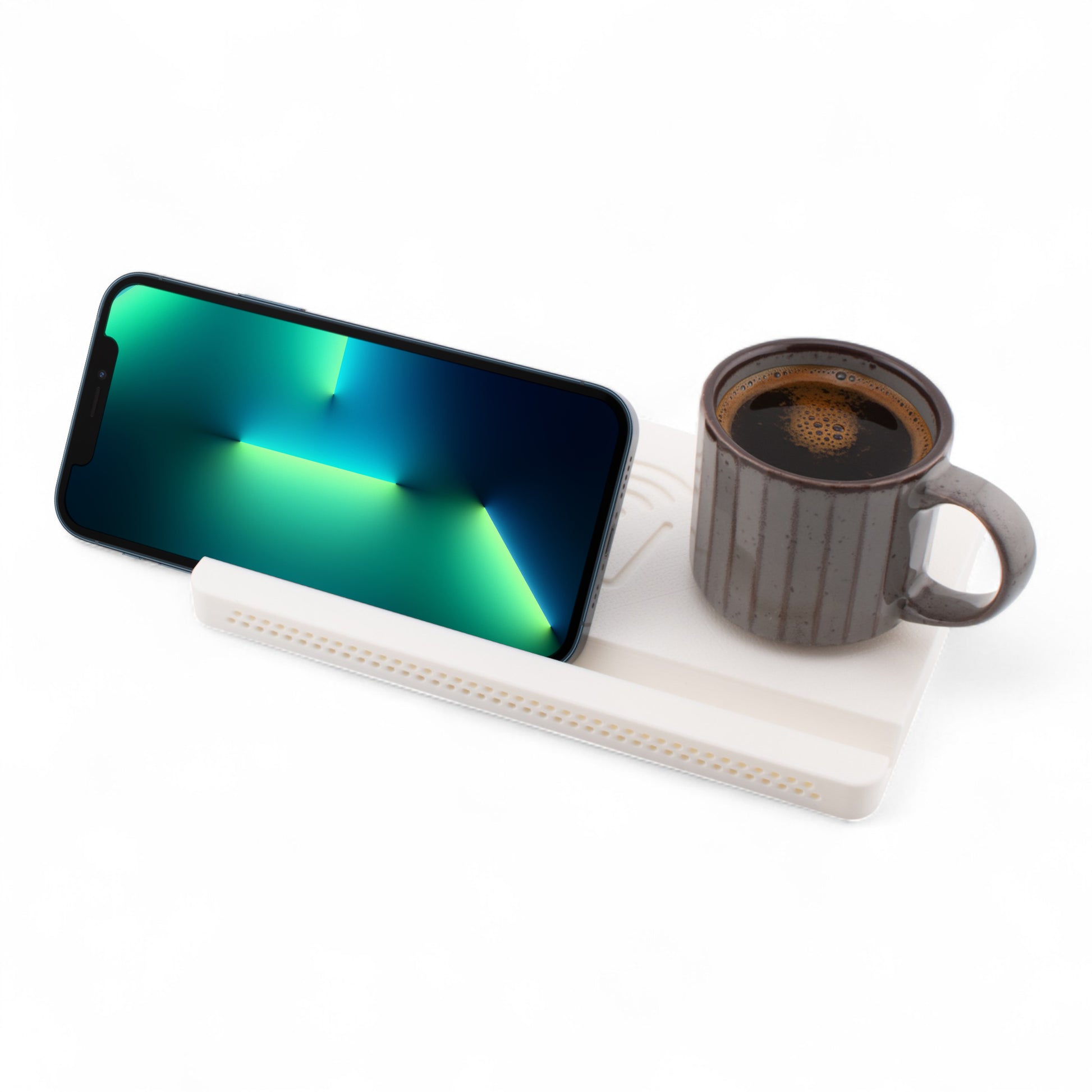 Landscape smartphone and coffee mug on a white coaster on a white background left angle