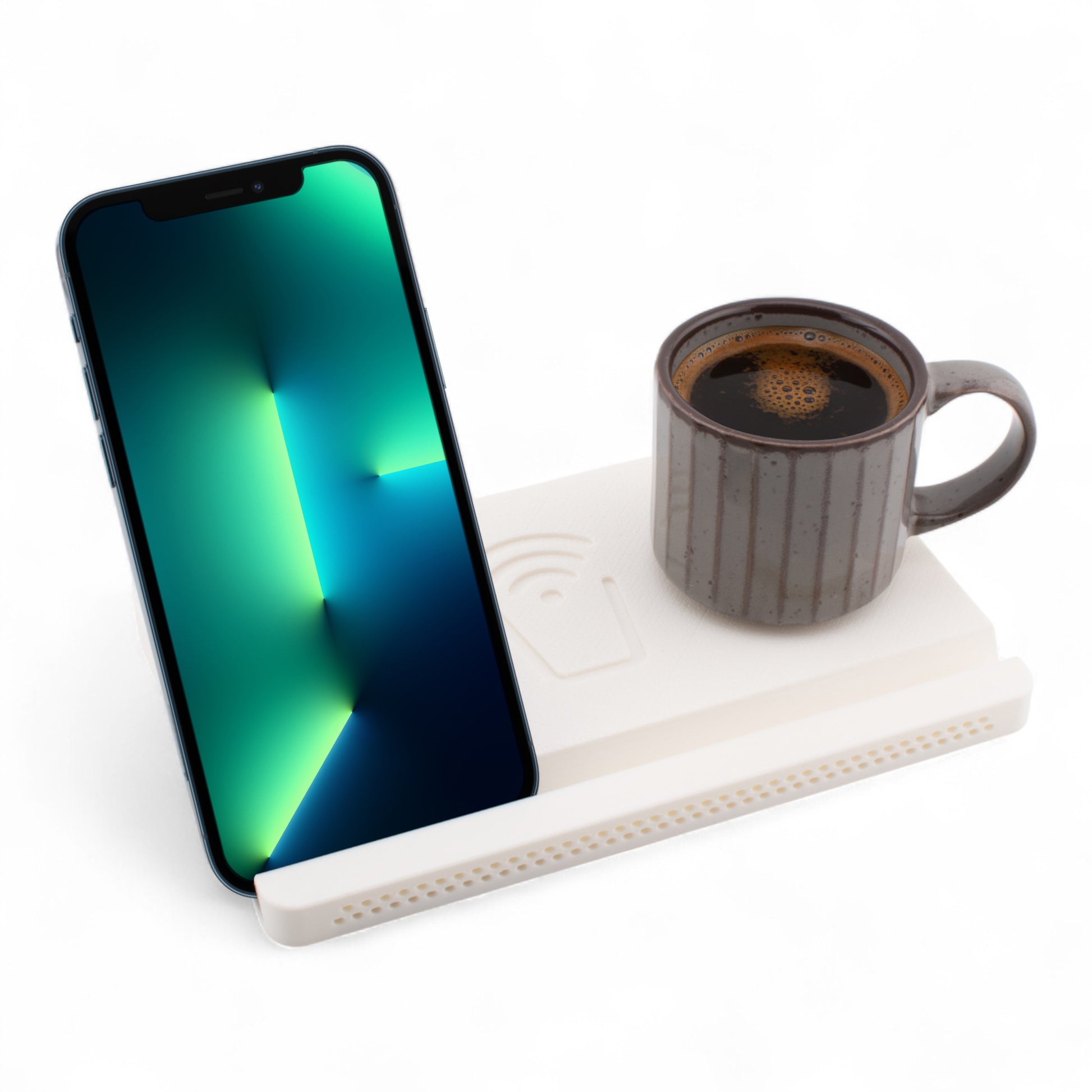 Smartphone and coffee mug on a white coaster on a white background right angle